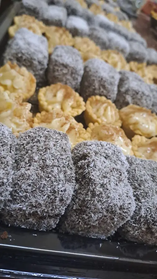 Rows of lamingtons and mini milk tarts